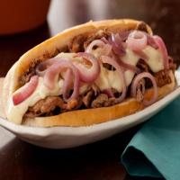 Philly Cheesesteaks with Melted Fontina and Sauteed Red Onions image