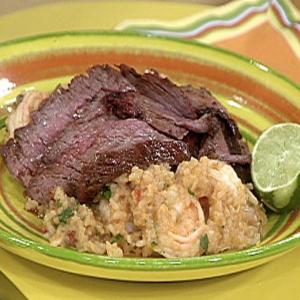 Sliced Chili Rubbed Flank Steak on Spicy Rice with Shrimp and Guacamole Stacks_image