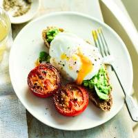 Poached eggs with smashed avocado & tomatoes image