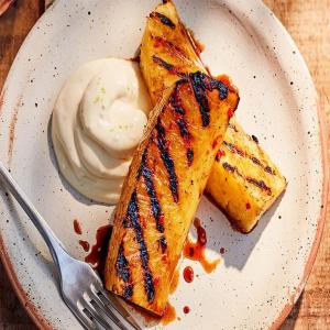 Rum-glazed grilled pineapple with lime crème fraîche image