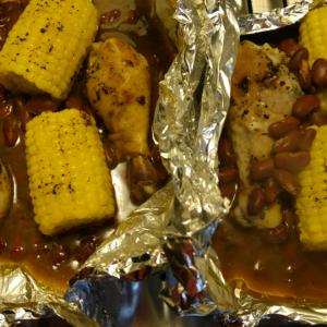 Foiled BBQ Chicken with Corn on the Cob and Pinto Beans image