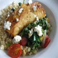 Greek Tilapia over Wilted Spinach image