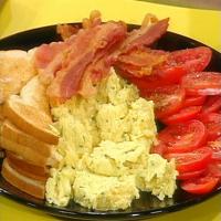 Herb and Egg Scramble with Garlic Toast and Sliced Tomato_image