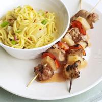 Sweet & sour chicken skewers with fruity noodles image