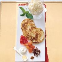 Blinis with Tapioca Caviar, Candied Fruits, Toasted Pecans, and Crème Fraîche_image