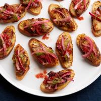 Roast Pork Belly Toasts with Blood-Orange BBQ Sauce and Pickled Red Onion image