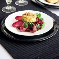 Baked goat's cheese with hazelnut crust & balsamic onions image