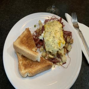 Corned Beef Hash With Poached Eggs Under Hollandaise_image