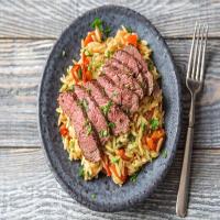 Herbed Sirloin Steak over Orzo Pasta Salad_image