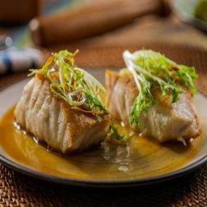 Pan-Seared Chilean Sea Bass with Frisee and Ponzu Butter image