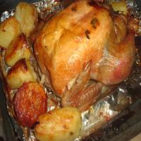 Onion Stuffed Roast Chicken With Potatoes_image