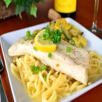 Grilled Fish With Garlic, White Wine and Butter Sauce image