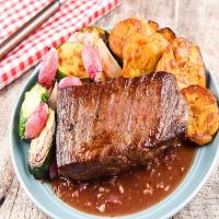 Venezuelan Asado Negro with roasted vegetables and tostones_image