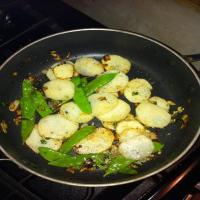 Pan fried red potatoes with snow peas image