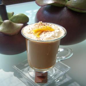 Orange Coffee Topped With Honey Nougat Chocolate And Orange Peel image