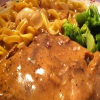 CENTER CUT PORK CHOPS AND NOODLES WITH MUSHROOM GRAVY AND BROCCOLI IN GARLIC BUTTER image