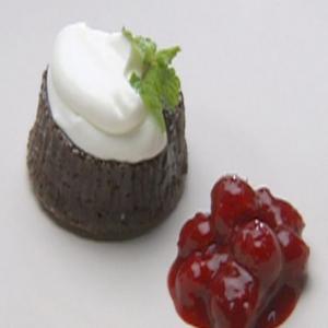 Warm Chocolate Gateaux Topped with Sour Cream Quenelle and Raspberry Sauce_image