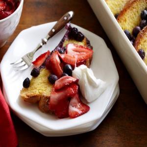 Blueberry French Toast Casserole with Whipped Cream and Strawberries image