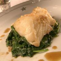 Ginger Sea Bass over Wilted Greens image