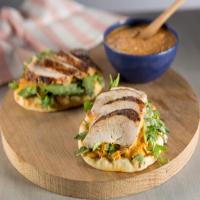 Spice-Rubbed Chicken Breast on Toasted Pita with Piquillo-White Bean Hummus and Arugula Salad image