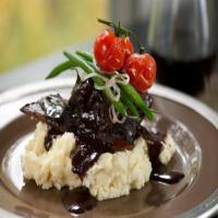 Braised Short Ribs on Garlic Mashed Potatoes With Green Beans an image