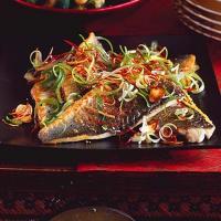 Sea bass with sizzled ginger, chilli & spring onions image