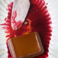 Creamy Chocolate-Cheese Flan with Hibiscus Sauce image