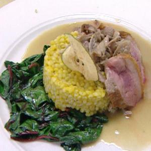 Duck with Pear Sauce and Wilted Greens image