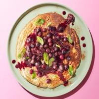 Banana & cinnamon pancakes with blueberry compote image