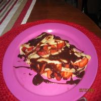 Crepes With Strawberries and Chocolate Sauce image
