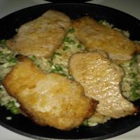 Pork Chops over Parmesan Rice With Peas image
