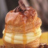 Soufflé of Puff Pastry with Orange-Scented Pastry Cream, Candied Pecans, and Caramel Butter Sauce image