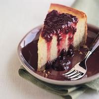 Orange Blossom Cheesecake with Raspberry and Pomegranate Sauce image