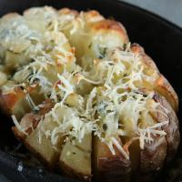 Blooming Baked Potato Recipe by Tasty image
