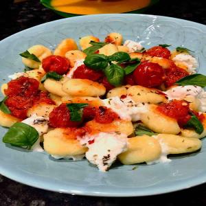 Gnocchi with mozzarella and cherry tomatoes sauce image