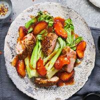 One-pan coriander-crusted duck, roasted plums & greens image