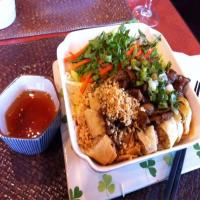 Rice Vermicelli Salad With Grilled Pork and Spring Rolls image