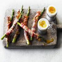 Soft-boiled duck egg with bacon & asparagus soldiers image