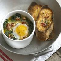 Spinach baked eggs with parmesan & tomato toasts image