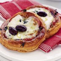 Mozzarella, tomato & black olive tarts image