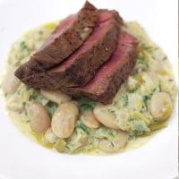Grilled fillet steak with the creamiest white beans and leeks_image