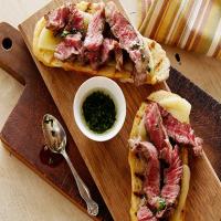 Mini Open Faced Steak Sandwiches on Garlic Bread with Aged Provolone and Parsley Oil image