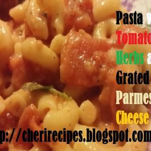 Pasta with Tomatoes Herbs and Grated Parmesan Chee_image