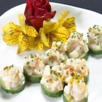 Seafood Ceviche on Cucumber Round Topped with Green Caviar_image