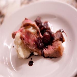 Rib Eye Steak with Roasted Grape-Red Wine Sauce and Creamy Parsnips and Potatoes image