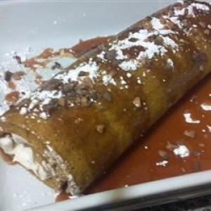 Pumpkin Roll with Toffee Cream Filling and Caramel Sauce image