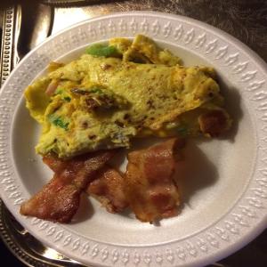 A Bacon Cheddar Western Omelette With Bacon on the Side image
