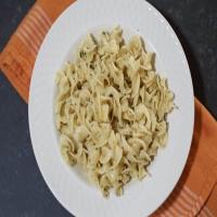 Egg noodles with herb butter sauce image