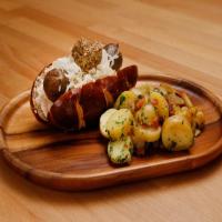 Pretzel Bun Reuben Sausage Sandwich with German-Style Potato Salad_image