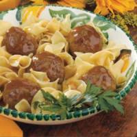 Tangy Meatballs Over Noodles image